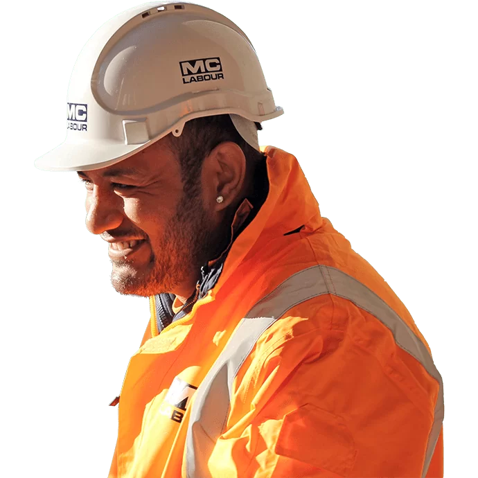 MC Labour worker wearing high viz and a hard hat smiling
